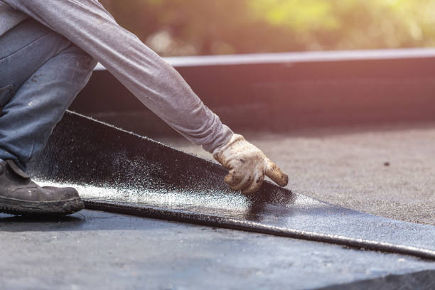 Professional Waterproofing technician working in Idlewild, MI